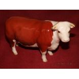 A Beswick Hereford cow, Ch. of Champions 12cm high