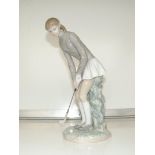 Lladro figure of a lady golfer 28cm high