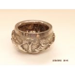 A Raj period Indian silver bowl, chased with vario