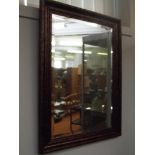 Framed bevelled edge wall mirror