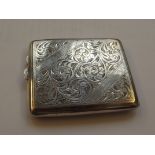 Silver cigarette case, profuse foliate decoration,