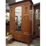 Edwardian oak mirrored wardrobe with base drawer