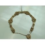 9 carat gold bracelet with heart lock and safety c