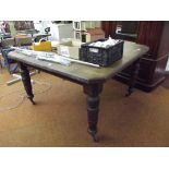 Victorian oak extending dining table on turned sup