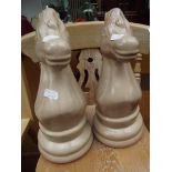 Pair of oversized knight chess pieces