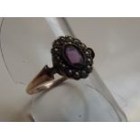 9 carat gold dress ring set with amethyst and seed