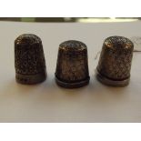 Three silver thimbles, one of which bearing Cheste