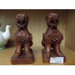 Pair of carved treen Chinthes