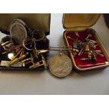 Collection of tie pins and cuff links together wit