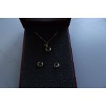 9 carat gold chain with pendant and earrings
