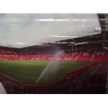 Large glass wall art depicting Old Trafford