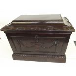 Early Victorian mahogany cellarette, sarcophagus form, swag decoration to the hinged lid and