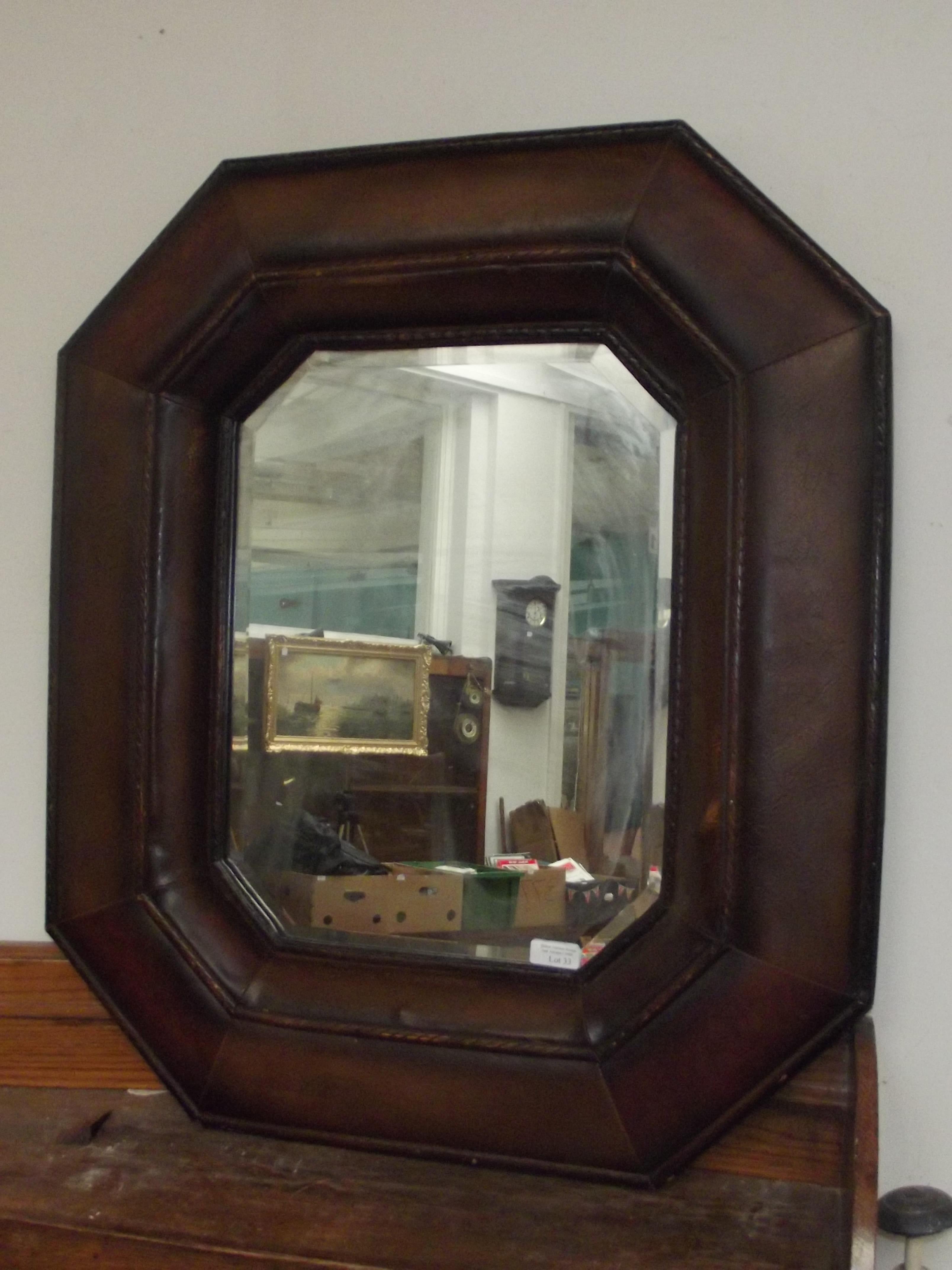 Octagonal faux leather framed mirror