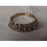 9 carat gold dress ring set with seven white gemst