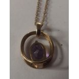 9 carat gold pendant set with amethyst diamonds on