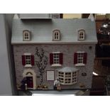 Large doll house in the form of an antique shop an