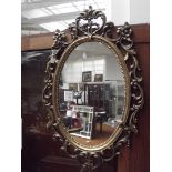 Gilt framed Rococo style wall mirror