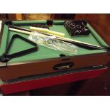 Small novelty table top pool table and accessorise