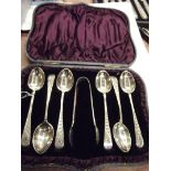 Cased set of six silver spoons with sugar tongs in