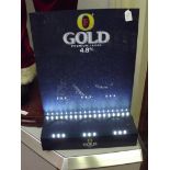 Fosters gold display stand
