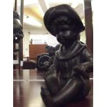 Bronze child sitting