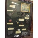 Cased reproduction golf balls and gold clubs