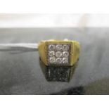 A gentleman's 18ct 9-stone diamond dress ring