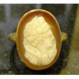 A hardstone ladies dress ring depicting a figure of a Tudor lady