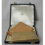 A cased 9ct gold cigarette case