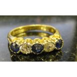 A five-stone sapphire and diamond ring set in an 18ct yellow gold mount