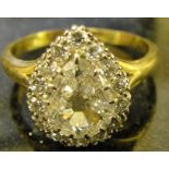 A pear-shaped diamond ring surrounded by 15 transitional cut stones