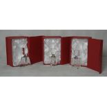 Three glass boxed perfume bottles