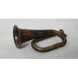 A miniature copper bugle