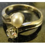 A natural pearl with transitional cut diamond ring