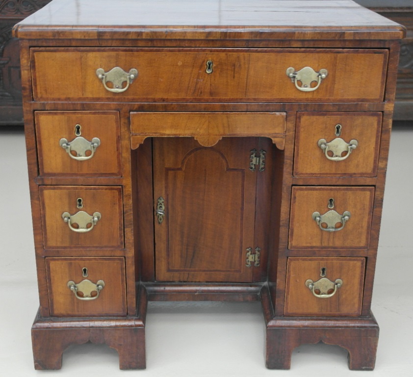 An 18th century walnut kneehole desk