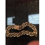 A gold fancy link bracelet