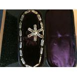 A 19th C cased Enamelled fancy link chain and pendant in fitted case,