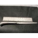 A silver ruler and pistol grip letter opener