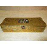 A Chinese brass pen box with enamel plaque