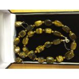 A tiger's eye necklace and earrings