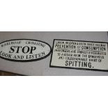 Two cast-iron railway signs: 'Stop' and 'No Spitting'