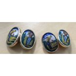 A pair of silver & enamel cuff links in the form of golfers