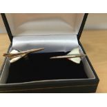 A pair of silver cuff links modelled as Concorde