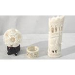 Three ivory items to inc puzzle ball,