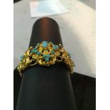 A vintage gold and turquoise bracelet,