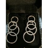 A boxed pair of 18ct and diamond drop hoop earrings,
