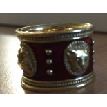 A boxed Elizabeth Gage enamelled lion mask ring