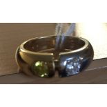 A Georg Jenson 18ct bi-metal ring set with diamond and green stone