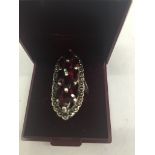 A silver dress ring with marcasite and red marquise stones