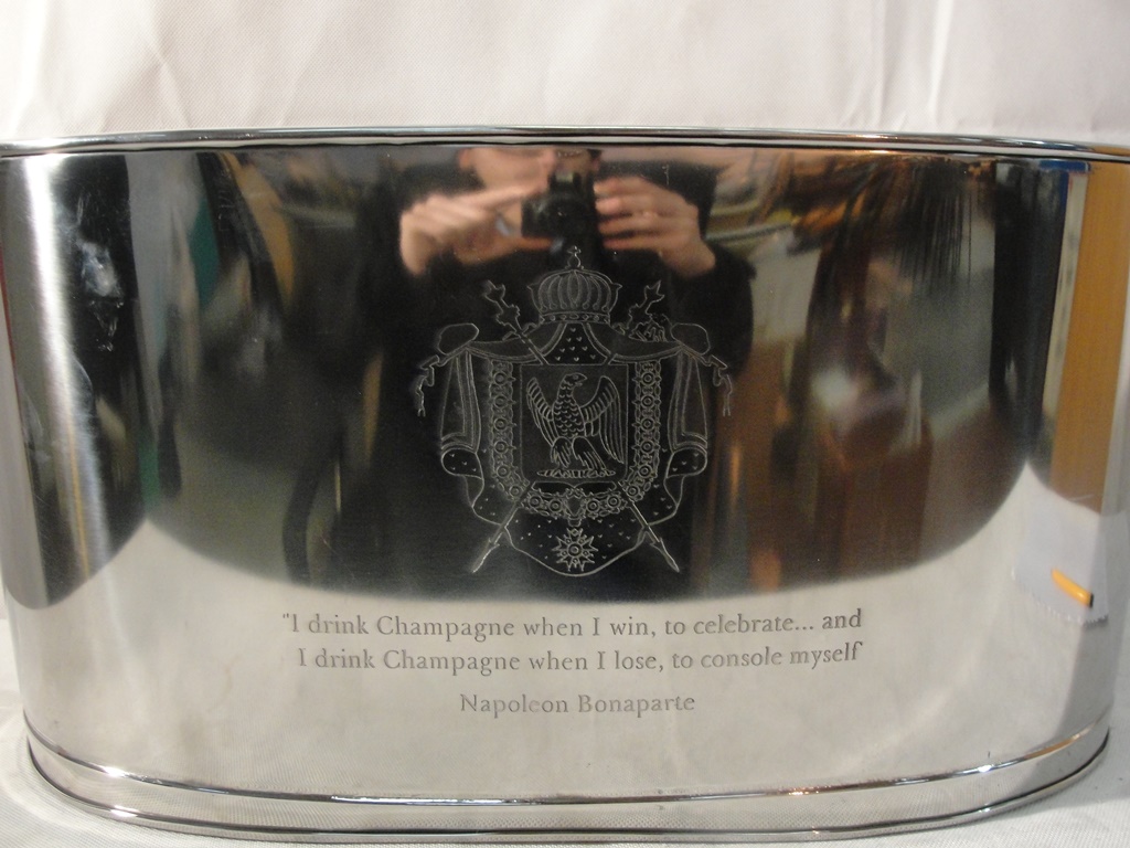 A large silver-plated champagne bucket